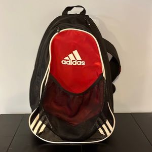Adidas cross shoulder back pack.